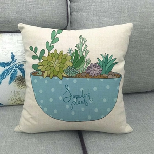 Detail of linen pillowcase with succulent plant illustration and soft fabric texture