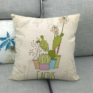 Detail view of linen texture on green cactus pattern throw pillow case on sofa