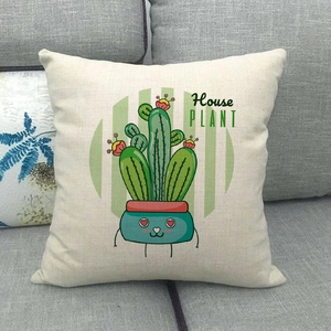 Detail of linen pillowcase featuring a cartoon cactus plant and House PLANT text