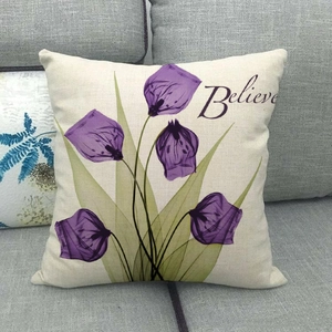Detail of square cushion cover featuring purple X-ray floral pattern and Believe text