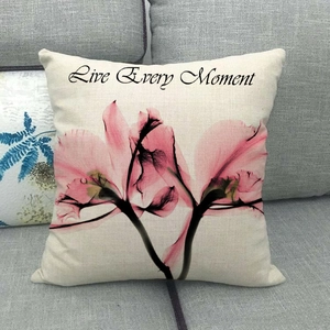 Detail of square pillowcase with X-ray floral print and Live Every Moment text
