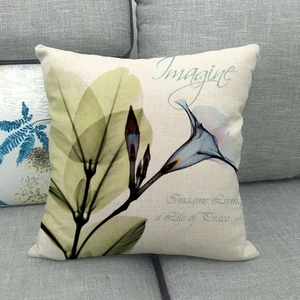 Macro detail of square pillowcase with X-ray floral pattern and rustic linen texture