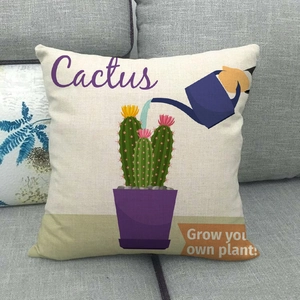 Detailed texture of linen pillowcase with cactus illustration on a grey sofa