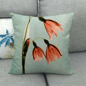 Close-up of artistic flower pillowcase texture on a grey sofa with vivid floral patterns
