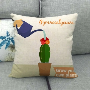 Close-up of a linen cactus cushion cover featuring a watering can design on a sofa