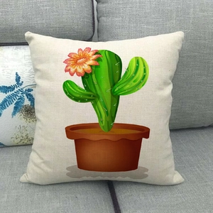 Detail of cartoon cactus print on linen pillowcase against a grey sofa background