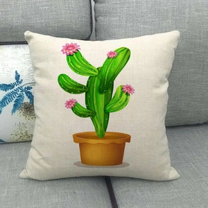 Detailed texture of linen cushion cover featuring cartoon green cactus on a grey sofa
