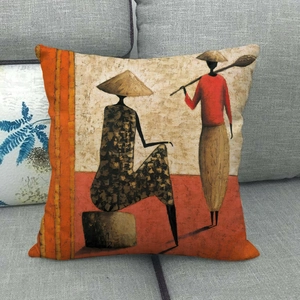 Dettaglio della trama del copricuscino in lino con pittura di donne africane