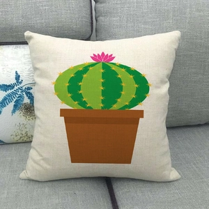 Close-up of a green cactus print on a beige linen throw pillow case on a sofa