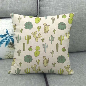 Close-up of cactus pattern linen pillowcase showing detailed fabric texture on sofa