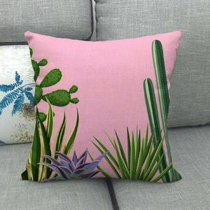 Detailed macro view of the woven linen texture and cactus plant pattern on this pillow case