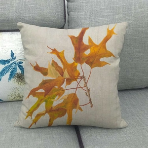Close-up of oak leaf print on natural linen pillow cover showing thick fabric texture