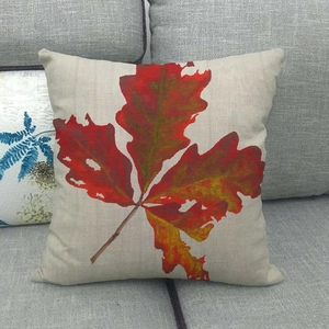 Detailed texture of autumn maple leaf print on breathable natural linen cushion cover
