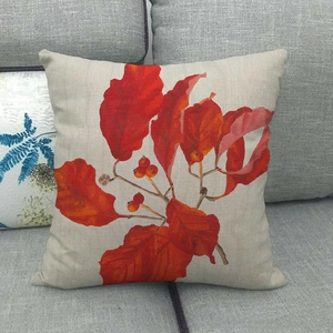 Linen autumn throw pillow cover featuring realistic red maple leaves and berries on a sofa