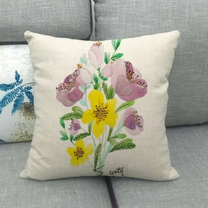 Detail of colorful watercolor floral print on textured linen throw pillow case