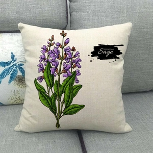Close-up of linen cushion cover featuring sage floral print on a dark grey sofa