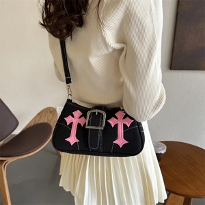 Y2K style black canvas underarm bag with pink cross embroidery and metal buckle detail