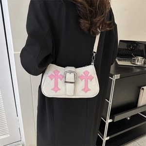 Chic beige crossbody bag featuring pink gothic cross patches and oversized silver metal buckle