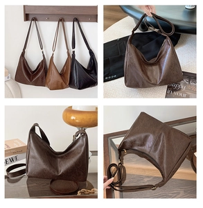Detail view of large retro PU leather tote bag with oily texture and adjustable shoulder strap
