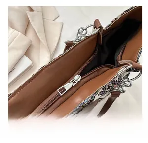 Macro shot showing smooth metal zipper and internal pocket of the woven tote bag