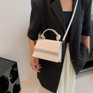 Chic white knotted handle crossbody bag in smooth faux leather for stylish women