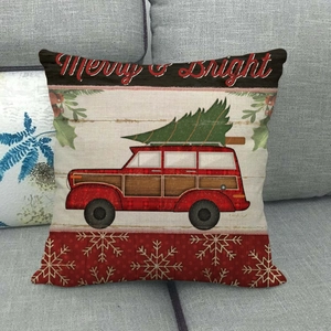 Close-up of linen Christmas pillow cover with vintage red truck and Merry & Bright text
