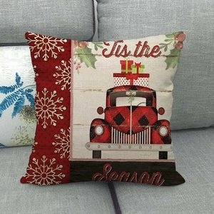 Detail of Christmas linen pillow cover featuring red vintage truck and 'Tis the Season text