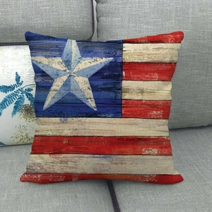 Linen square pillowcase with vintage American flag pattern on a rustic wood texture