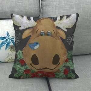 Detailed texture of linen Christmas pillowcase featuring a cute reindeer and holly pattern