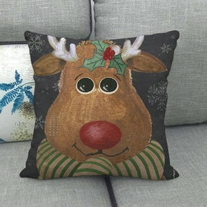 Macro detail of Christmas reindeer pattern on dark grey linen throw pillowcase cover
