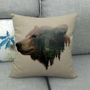 Artistic double exposure pillow cover featuring a brown bear and forest on linen fabric
