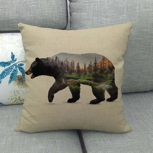 Close-up of beige linen pillowcase showing double exposure bear and forest print detail