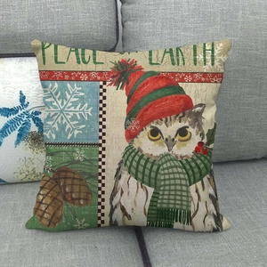 Close-up of linen pillowcase with owl pattern and Peace on Earth text detail