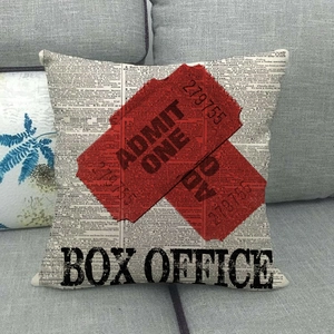 Detail of vintage movie ticket design pillow cover with Admit One print on sofa