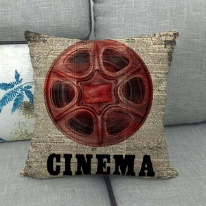 Macro detail of a vintage cinema film reel pattern on linen square throw pillow cover
