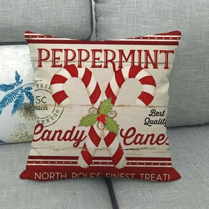 Detailed texture of linen Christmas pillowcase with red peppermint candy cane patterns