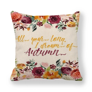 Detail of linen pillowcase with floral prints and Autumn dream typography