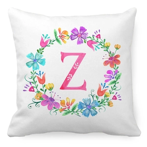 Detailed close-up of wreath floral pattern with pink letter Z on peach skin pillowcase