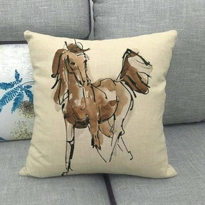 Artistic ink horse painting pillowcase detail on a grey sofa with linen texture
