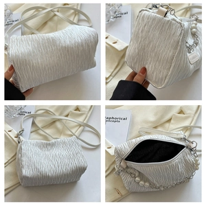 Detailed views of a white pleated crossbody bag featuring pearl chain and fashion label