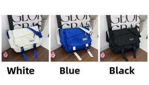 Detailed view of large capacity crossbody messenger bags in white, blue and black nylon