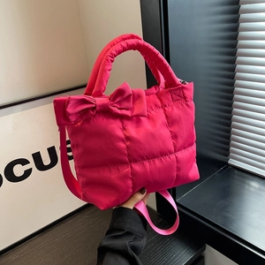 Quilted rose pink tote bag with bow detail and adjustable strap for women