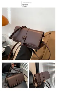 Detalle del bolso de hombro de cuero café con asa trenzada y hebilla dorada elegante