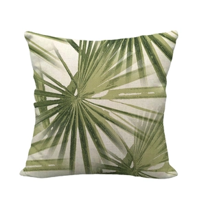 Minimalist square linen pillowcase featuring green tropical palm leaf printed patterns