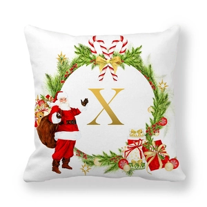 Macro detail of Christmas pillowcase showing letter X with festive berry and pine motifs