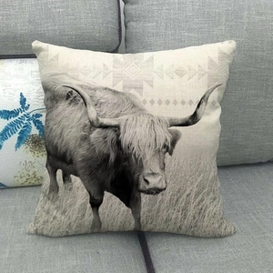 Detail of square cotton linen pillowcase featuring a realistic black and white yak print