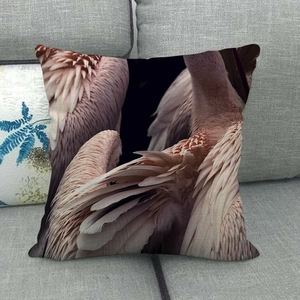 Macro detail of soft pink flamingo feather pattern on square throw pillow cover
