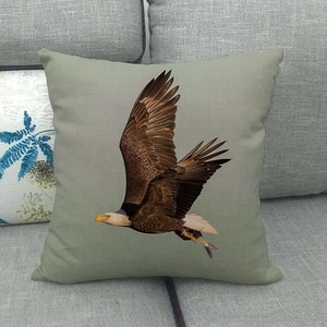 Detail of the cotton linen pillow cover with a realistic eagle catching fish print