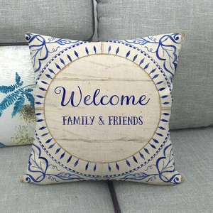 Linen cushion cover with blue floral wreath and Welcome Family & Friends print