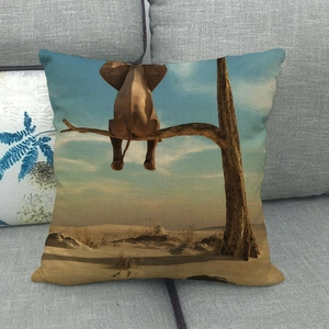 Linen square pillowcase featuring a creative surreal elephant sitting in a desert landscape